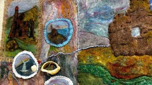 Felted engine houses on a hessian background produced as part of Wildworks' Story Shelter project